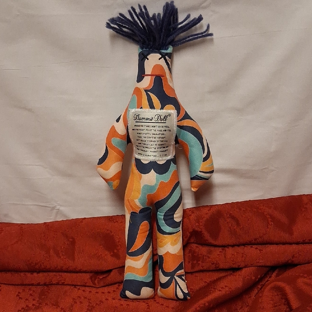 Dynamic Doll with Blue Hair and Vibrant Patterns